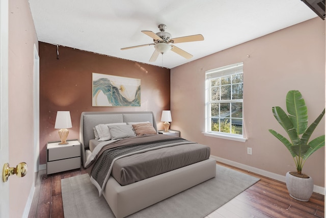 bedroom featuring ceiling fan and hardwood / wood-style flooring