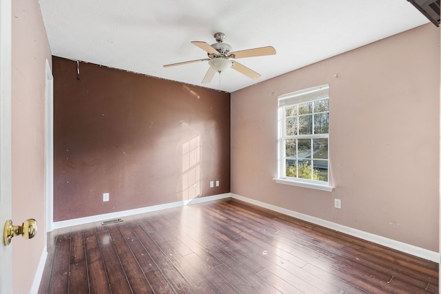 unfurnished room featuring ceiling fan and dark hardwood / wood-style flooring