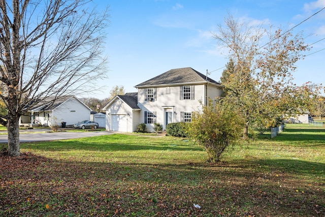 view of front of house featuring a garage and a front yard