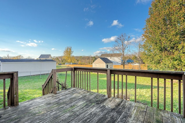 wooden deck featuring a yard