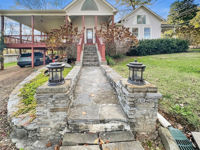 view of front of home with covered porch and a front yard