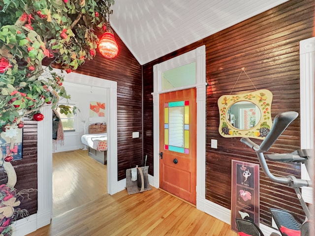 interior space with wood-type flooring and vaulted ceiling