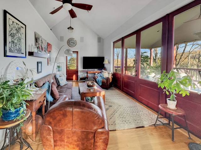 living room featuring french doors, light hardwood / wood-style floors, high vaulted ceiling, and ceiling fan