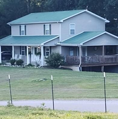 1159 New Hope Rd, Celina, TN 38551 - view of front of house with covered porch, a front lawn, and metal roof