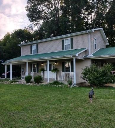 1159 New Hope Rd, Celina, TN 38551 - view of front facade featuring covered porch and a front yard