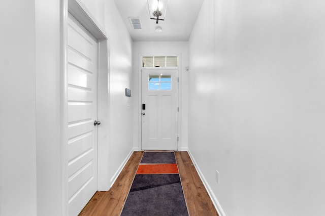 doorway featuring wood-type flooring