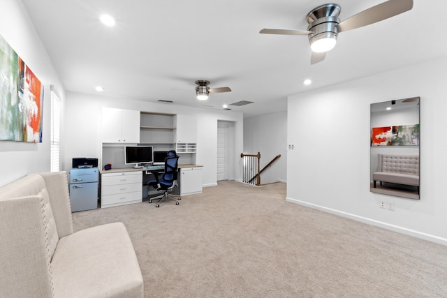 office space with ceiling fan and light colored carpet