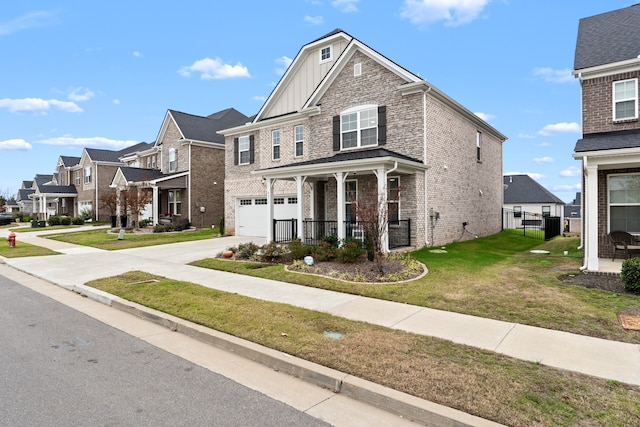 view of front of home featuring a front lawn, a garage, and a porch