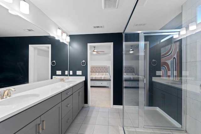 bathroom with ceiling fan, tile patterned floors, and vanity