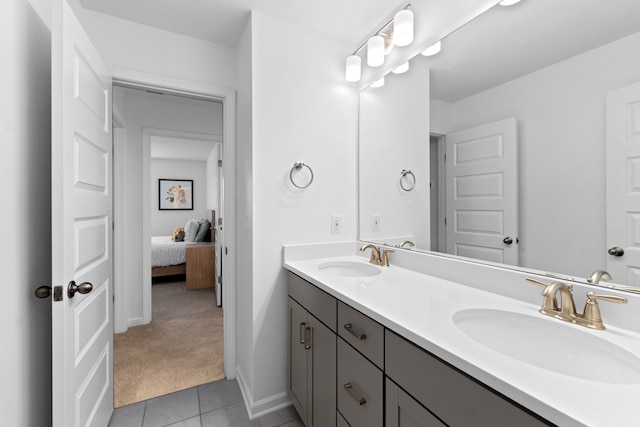 bathroom with tile patterned floors and vanity