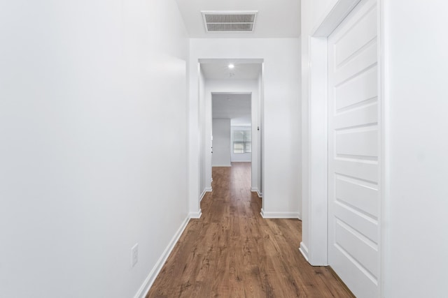 hall with dark wood-type flooring