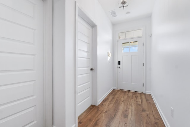 doorway featuring wood-type flooring