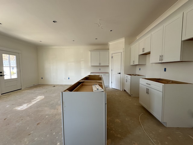 kitchen featuring white cabinets and a center island