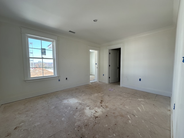 spare room with crown molding