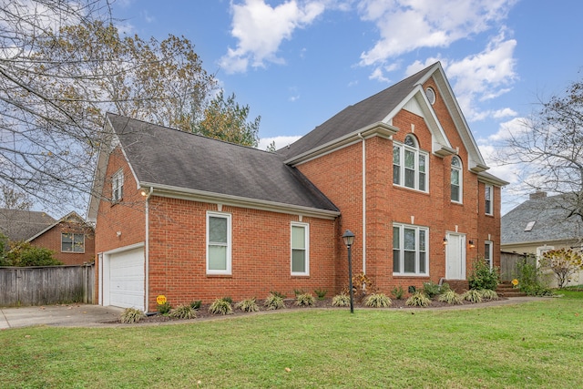 view of front facade with a front yard and a garage