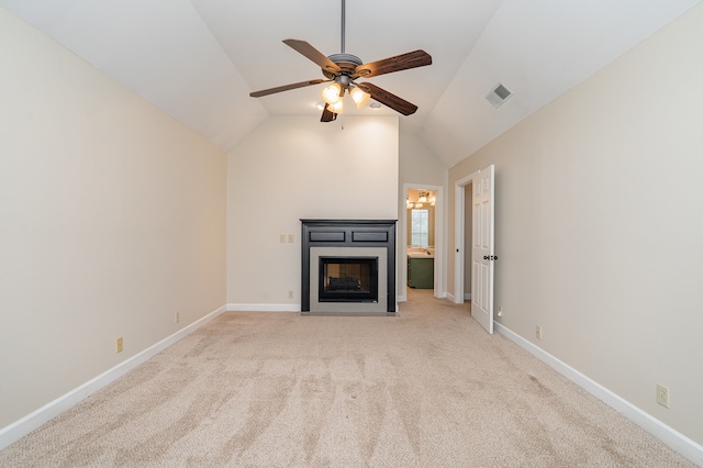 unfurnished living room with light colored carpet, vaulted ceiling, and ceiling fan