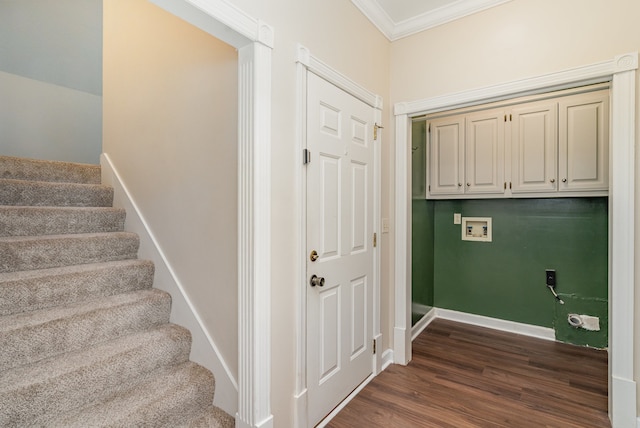 laundry room with hookup for a washing machine, dark hardwood / wood-style flooring, cabinets, and ornamental molding