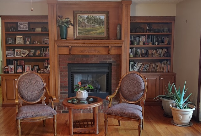 living area featuring a fireplace and hardwood / wood-style floors