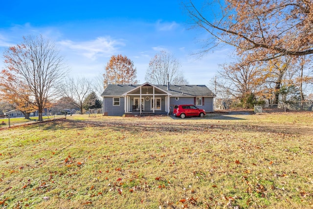 view of front of home featuring a front yard and a garage