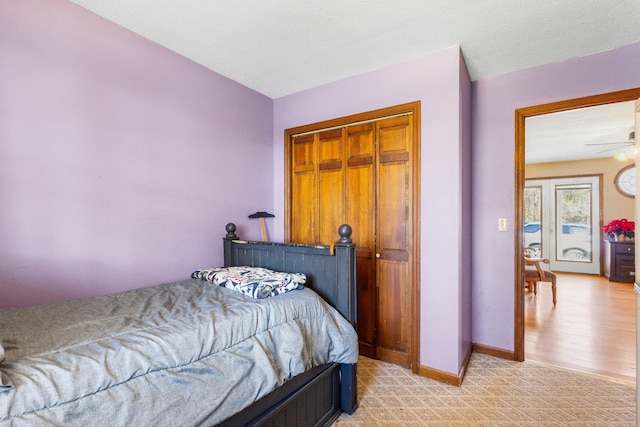 bedroom featuring a closet, a textured ceiling, and light wood-type flooring