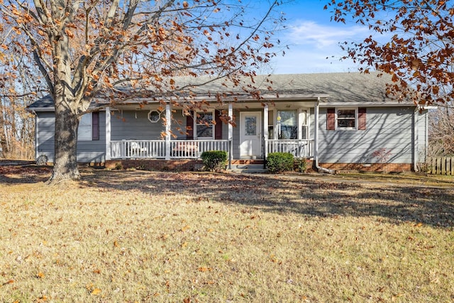 single story home with covered porch and a front yard