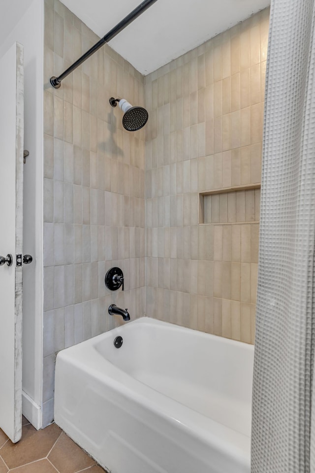 bathroom featuring tile patterned flooring and shower / tub combo