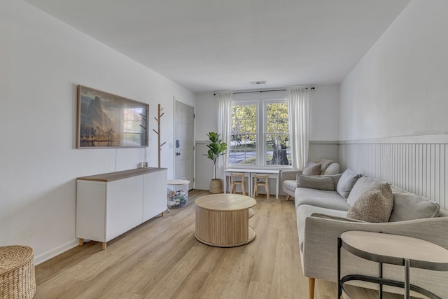 living room with light hardwood / wood-style flooring