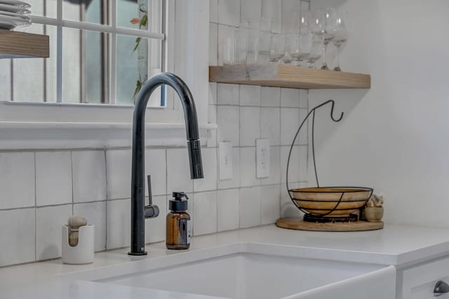 details with decorative backsplash and sink