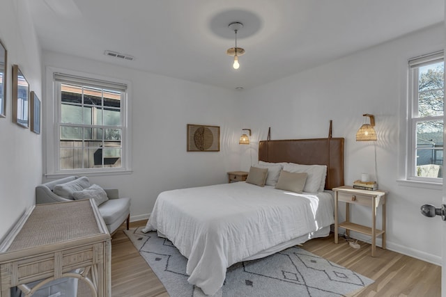 bedroom with light wood-type flooring