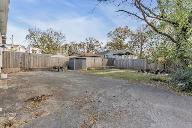 exterior space featuring a shed and a patio