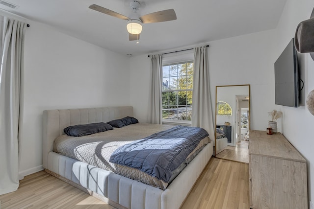 bedroom featuring light wood-type flooring and ceiling fan