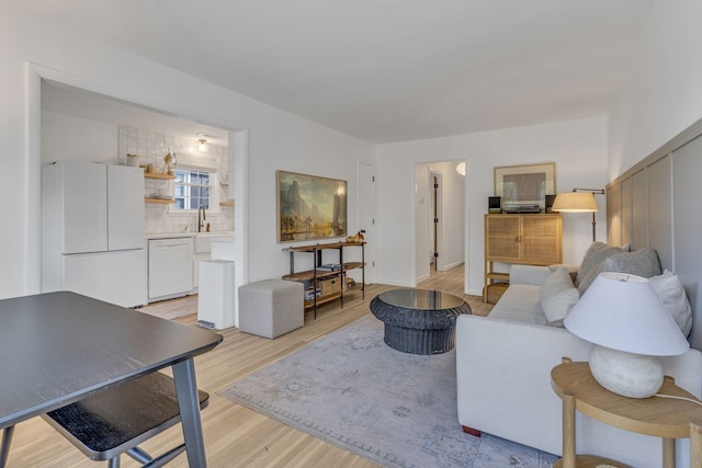 living room with light hardwood / wood-style flooring