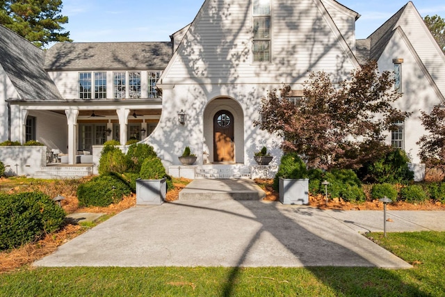 view of front of house featuring ceiling fan and a porch