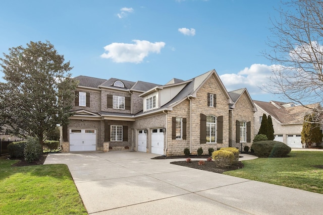 view of front of home with a garage and a front yard