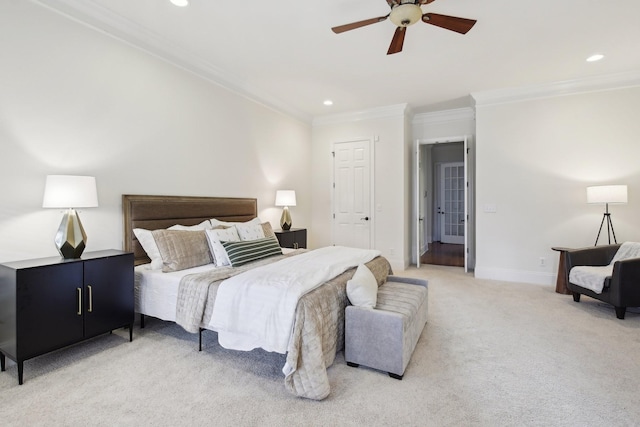 bedroom featuring ornamental molding, light colored carpet, and ceiling fan