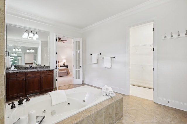 bathroom featuring vanity, tile patterned floors, ornamental molding, and tiled bath