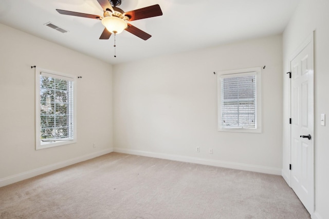 carpeted empty room featuring ceiling fan