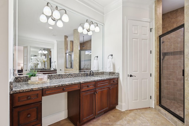 bathroom with crown molding, vanity, and a shower with shower door