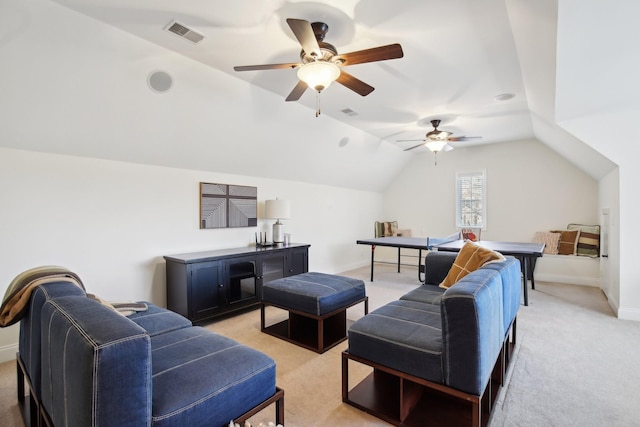 carpeted living room featuring lofted ceiling