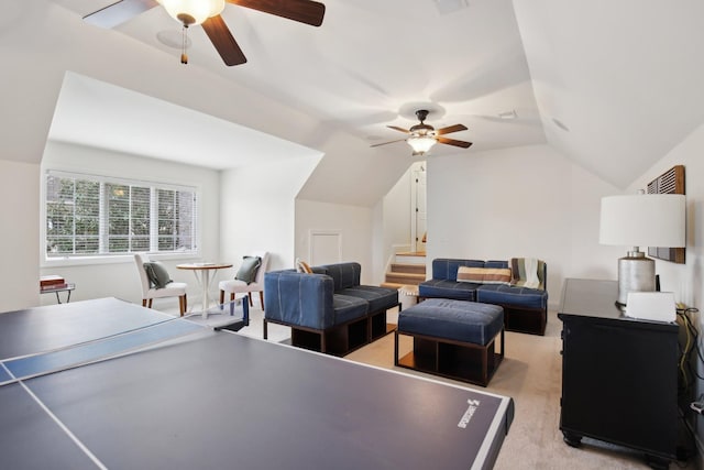 game room with lofted ceiling, light carpet, and ceiling fan