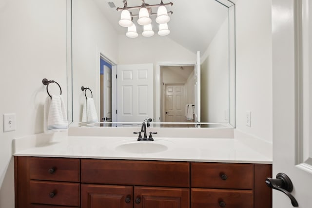 bathroom featuring vanity and vaulted ceiling