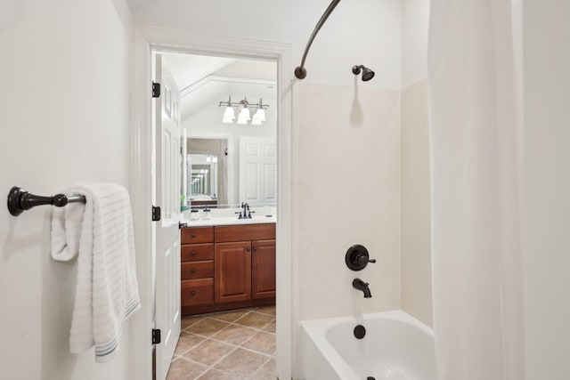 bathroom with bathing tub / shower combination, vanity, and tile patterned floors