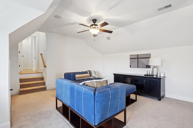 bedroom with lofted ceiling, light carpet, and ceiling fan