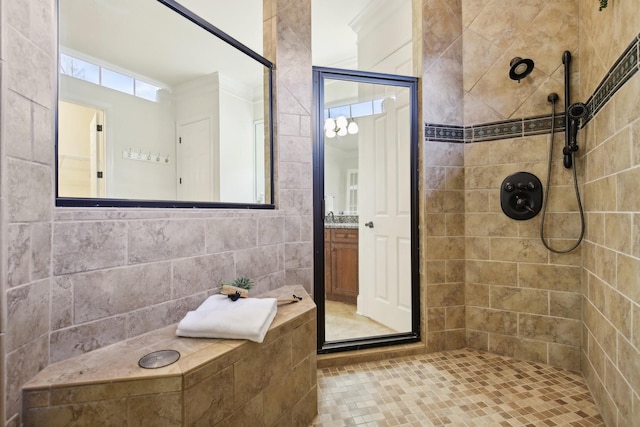 bathroom featuring vanity and a tile shower