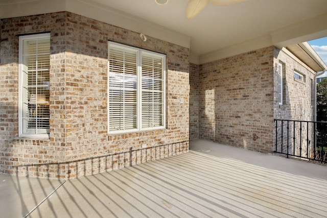 wooden terrace featuring ceiling fan