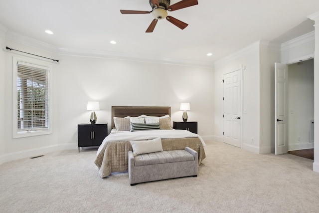 carpeted bedroom with crown molding and ceiling fan