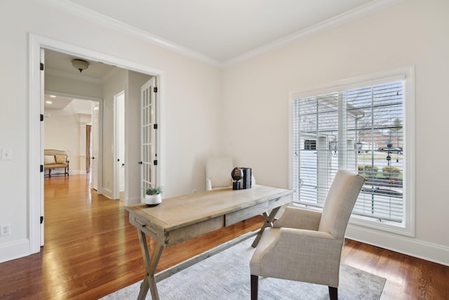 office area with ornamental molding and dark wood-type flooring