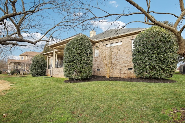 view of property exterior featuring a lawn