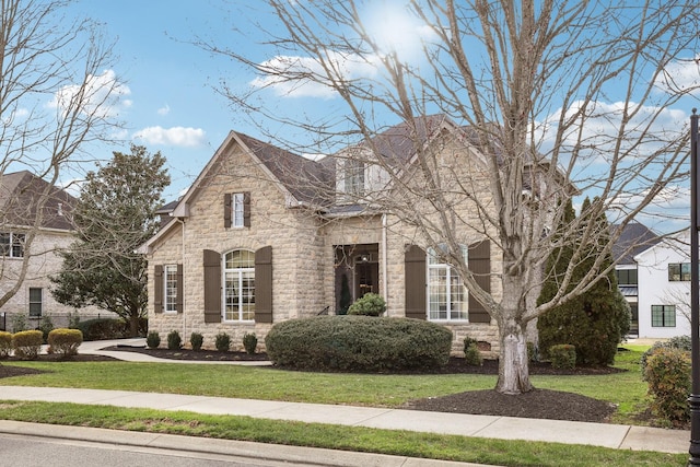 view of front of home with a front lawn