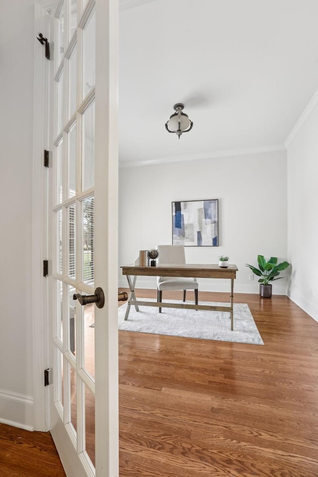 office area featuring hardwood / wood-style flooring, crown molding, and french doors